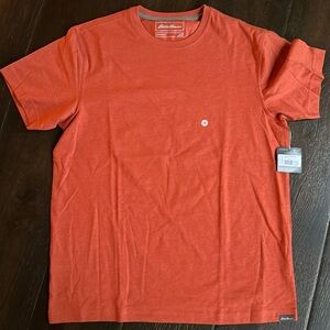 New with tags, orange LEGENDWASH men’s Eddie Bauer tshirt, size medium.